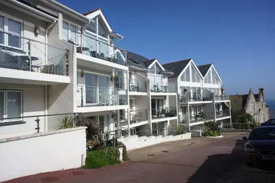 a row of apartment buildings with balconies at The Waves in St Ives