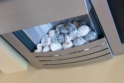 a box full of rocks sitting on a wall at Dolphin Watch in Carbis Bay