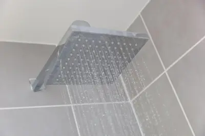 a metal shower grate on the wall of a bathroom at Chy Lowen in Carbis Bay