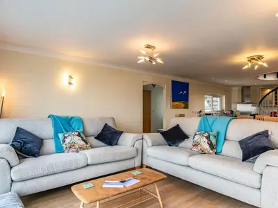 a living room with two couches and a coffee table at Blue Ridge in Wadebridge