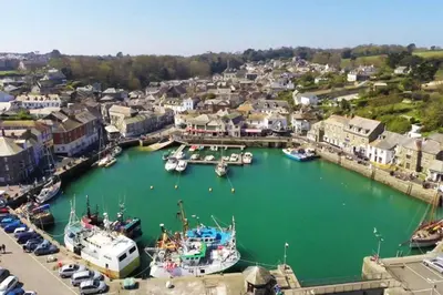 a group of boats are docked in a harbor at Poppy's Place Annex in Camelford North Cornwall in Camelford