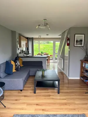 a living room with a couch and a table at Atlantic Lodge in Newquay