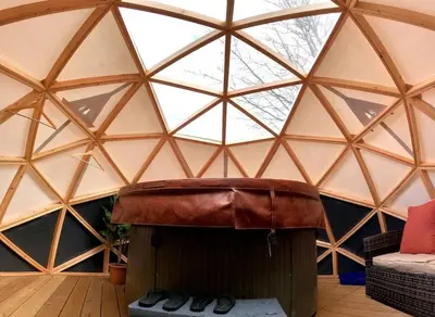 a room with a dome with a bench in it at Romantic Treehouse with Hot Tub & BBQ Lodge in Praze an Beeble
