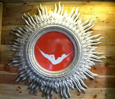 a silver mirror with a picture of a bird on it at Romantic Retreat - Luxury Shepherds Hut + Hot Tub! in Camborne