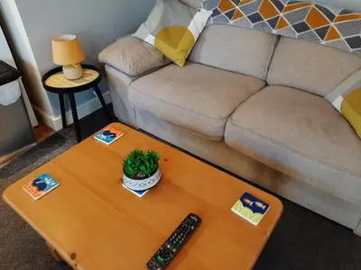 a living room with a couch and a coffee table at Cozy Courtyard Apt Explore & Relax Free Parking in Bodmin