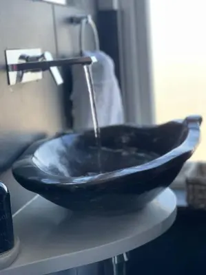 a black sink with a faucet in a bathroom at Marners Rock No 2 in Fowey