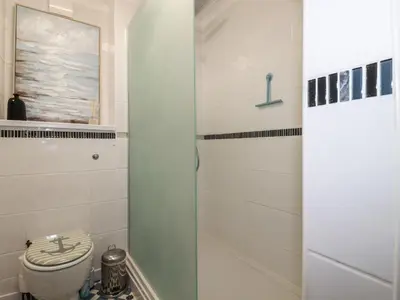 a bathroom with a toilet and a sink at Melvill Lower Deck in Falmouth