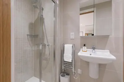 a bathroom with a shower and a sink at Monowai Heights in St Ives