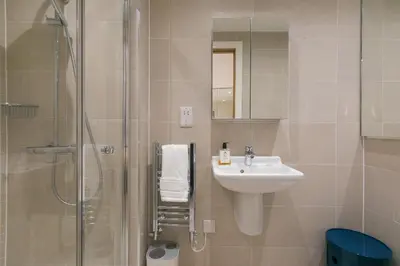 a bathroom with a sink and a shower at Monowai Heights in St Ives
