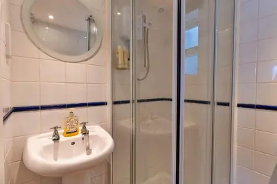 a bathroom with a sink and a shower at Finest Retreats - Salvay in Porthleven
