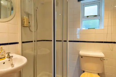 a bathroom with a shower and a toilet and a sink at Finest Retreats - Salvay in Porthleven
