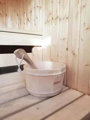 a bucket sitting on a table with a wooden wall at George24 - spectacular, 5 minutes to the beach in Newquay