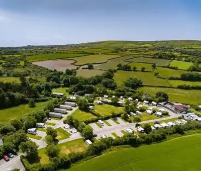 an aerial view of a parking lot with cars at Polladras Holiday Park in Helston