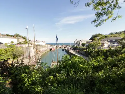 a body of water with a boat in it at Sea View in St Austell
