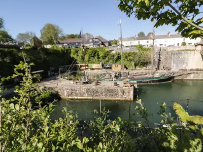 a couple of boats docked in a harbor at Sea View in St Austell