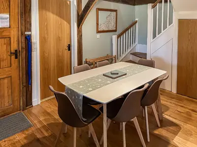 a dining room with a table and chairs at Chy An Dour in Davidstow