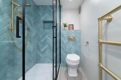 a bathroom with a toilet and a shower at The Lost Lobster in St Ives