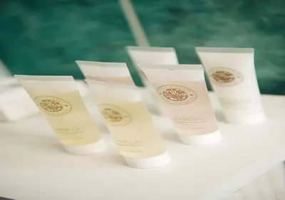 a group of four tubes of sunscreen sitting on a table at Orchard House Wadebridge Self Catering in Wadebridge