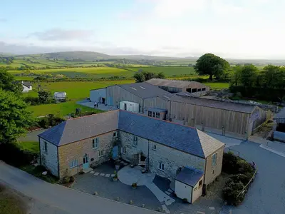an aerial view of a large building with a lot at Rosehip Barn in Launceston