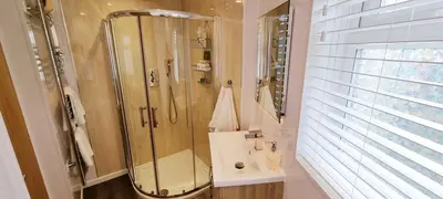 a bathroom with a shower and a sink at Looe Holiday Home Cornwall Sleeps 2 Self Catering No Pets in Looe