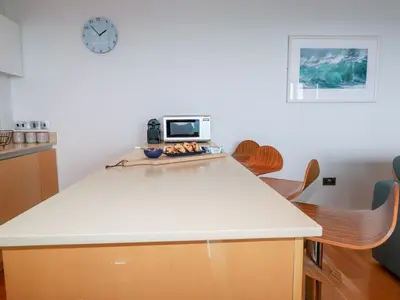 a kitchen with a counter top with a microwave on it at Fistral Pearl in Newquay