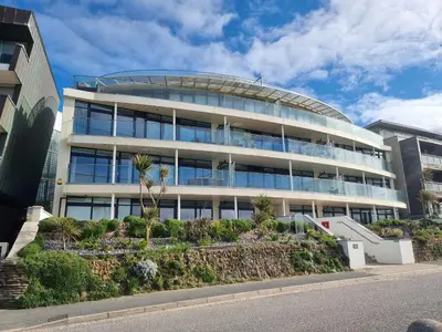 a large office building with a lot of windows at Fistral Pearl in Newquay