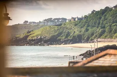 a view of a beach with houses on a hill at 2 Bed in St. Ives oc-p00568 in St Ives