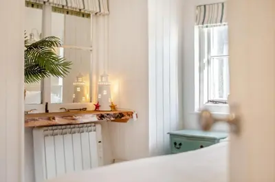 a bathroom with a mirror and a sink and a window at 2 Bed in St. Ives oc-p00568 in St Ives