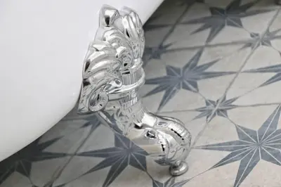 a silver figurine of a shoe on a floor at WALK TO THE BEACH, spacious cottage with sea views in St Merryn