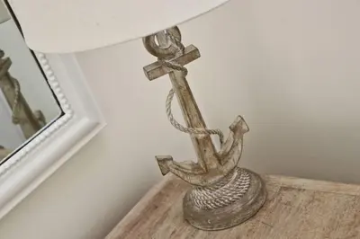 a metal lamp sitting on top of a table at WALK TO THE BEACH, spacious cottage with sea views in St Merryn