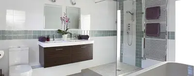 a bathroom with a toilet and a sink and a shower at Stargazers in Saint Mawes