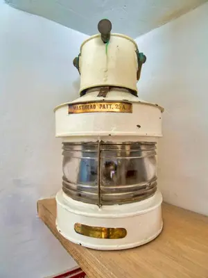 a blender sitting on top of a wooden shelf at Knocker Cottage is a 3 bedroom made up of 1 double bedroom and 2 small double bedrooms in small village 10 min to beaches in Camborne