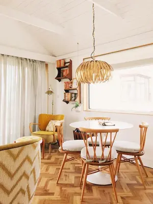 a dining room with a table and chairs at Sands Studio and Samphire Studio in St Ives