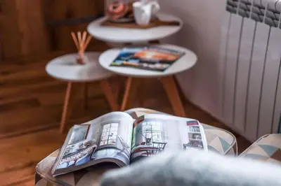 a book sitting on top of a table at Beach Lovers Paradise in Portreath - With Sea Views & Log Burner just 100m from beach in Portreath