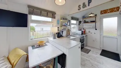a kitchen with a white counter top in a room at F17 Up-A-Bank, Riviere Towans in Hayle