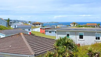 a town with houses and the ocean in the background at F17 Up-A-Bank, Riviere Towans in Hayle