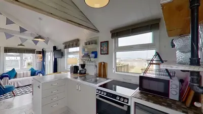 a kitchen with a sink and a counter top at F17 Up-A-Bank, Riviere Towans in Hayle