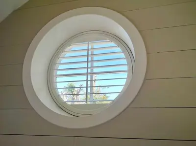 a round window in the ceiling of a room at The little post house. A perfect village retreat, with stunning views. in Boscastle