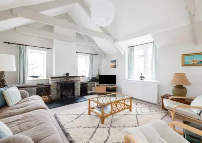 a living room with a couch and a coffee table at Little Pityme in Wadebridge