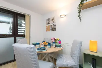 a dining room with a table and chairs at Dream Achieved in St Ives