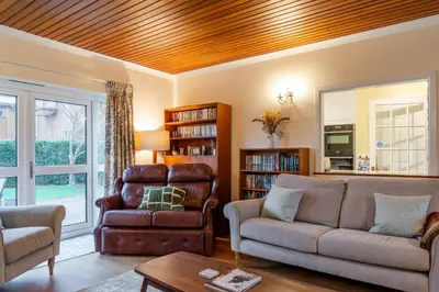 a living room with a couch and a chair at Finest Retreats - Sunny Nook in Padstow
