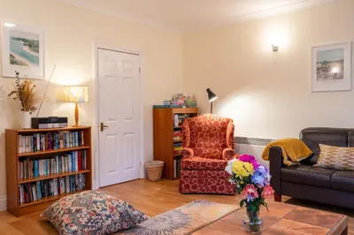 a living room with a couch and a chair at Finest Retreats - Sunny Nook in Padstow
