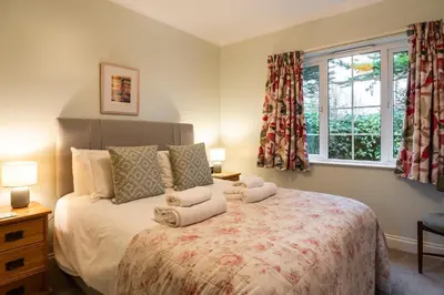 a bedroom with a bed with towels on it at Finest Retreats - Sunny Nook in Padstow