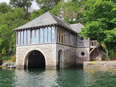 a building in the middle of a body of water at Oakenhurst in Fowey