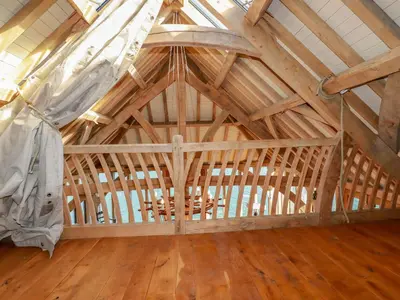 a room with a wooden ceiling in a barn at Oakenhurst in Fowey