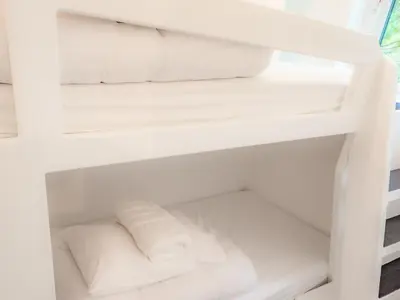 a white refrigerator filled with lots of white towels at Owl - Uk43447 in Hayle