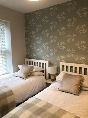 two beds sitting next to each other in a bedroom at 4 Quay View, Looe in Looe