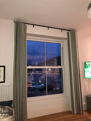 a window with a view of a city at 4 Quay View, Looe in Looe