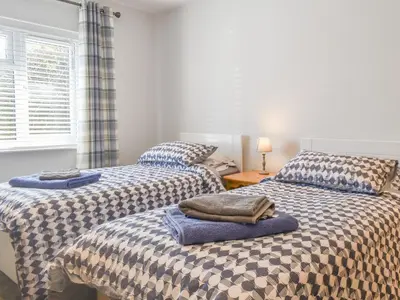 two beds sitting next to each other in a bedroom at The Batch in St Merryn
