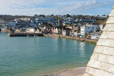 a view of a city from a bridge over a body of water at Beach Vista, harbourside in St Ives in St Ives